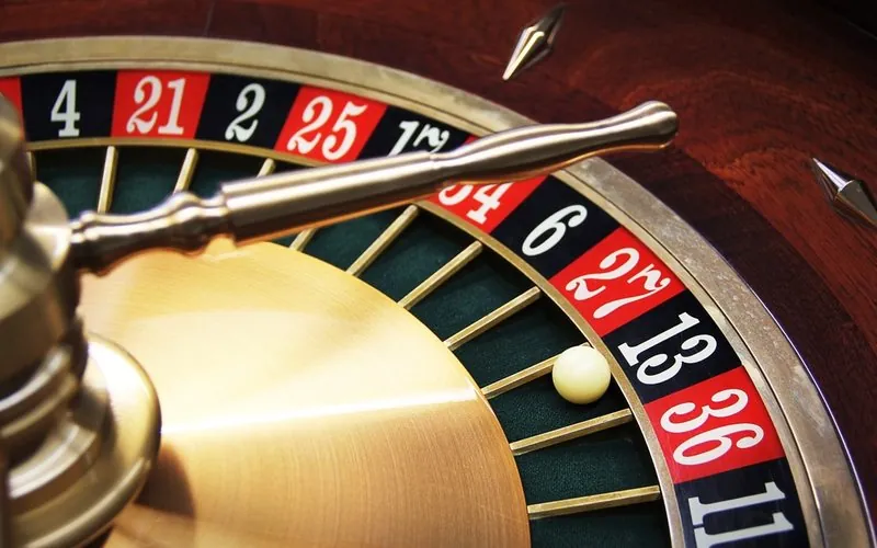 Roulette wheel close-up with the ball in a numbered pocket