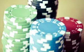 Stacks of green, blue and red casino chips